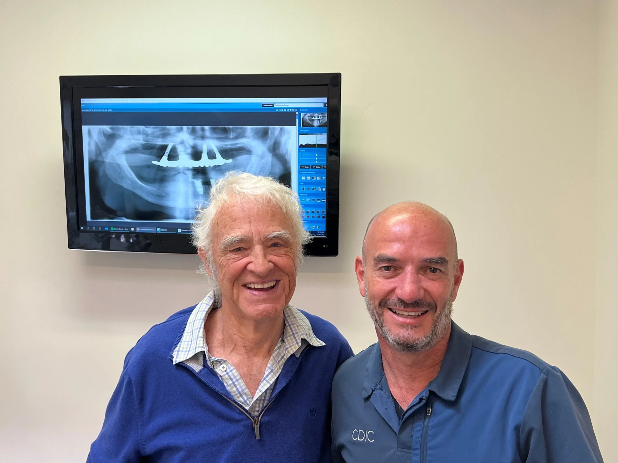 Dr Hillel New with a full arch dental implants patient.