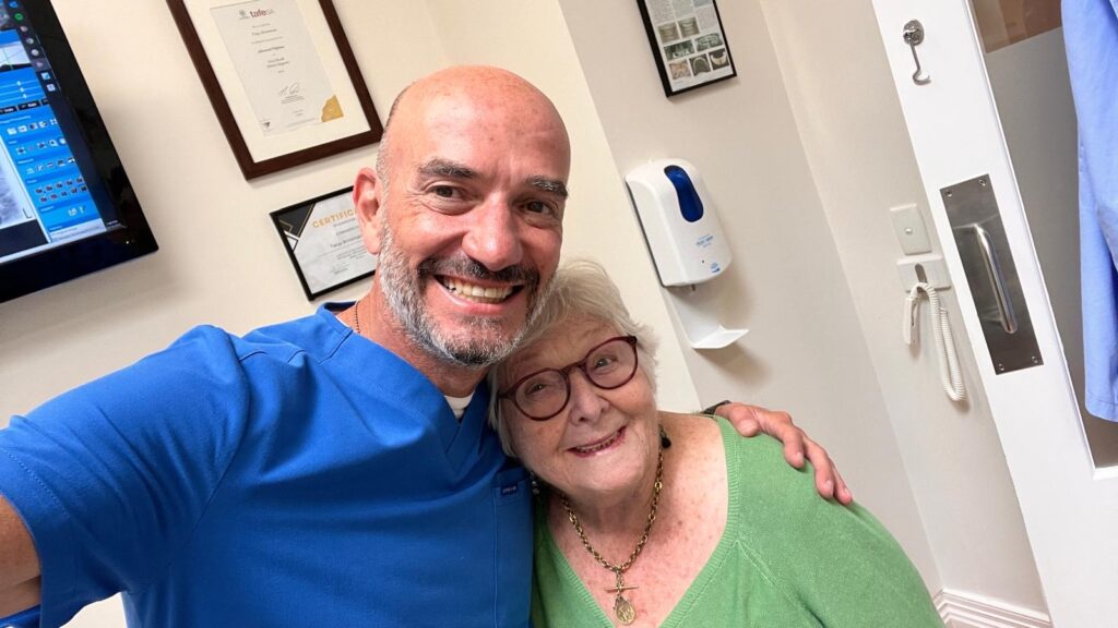 Dr Hillel New and a patient after a dental check-up.