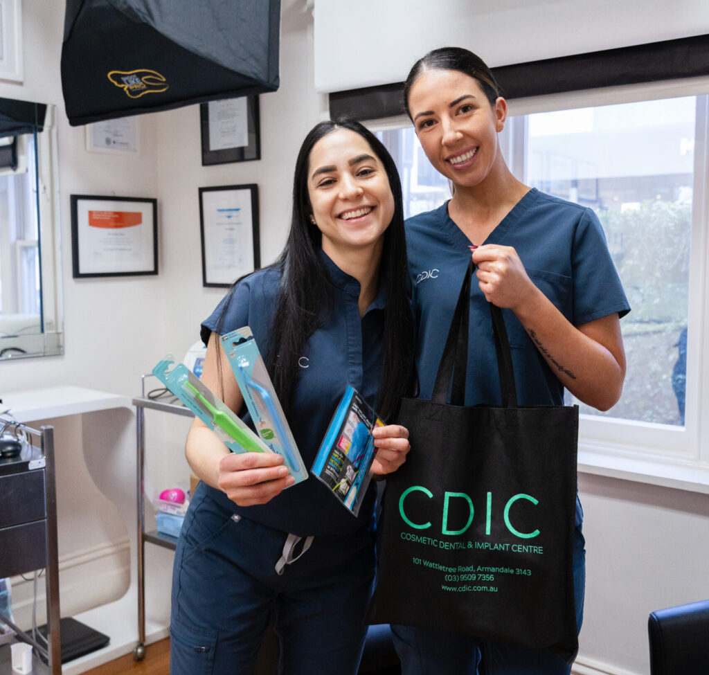 Team members at CDIC with dental hygiene tools.