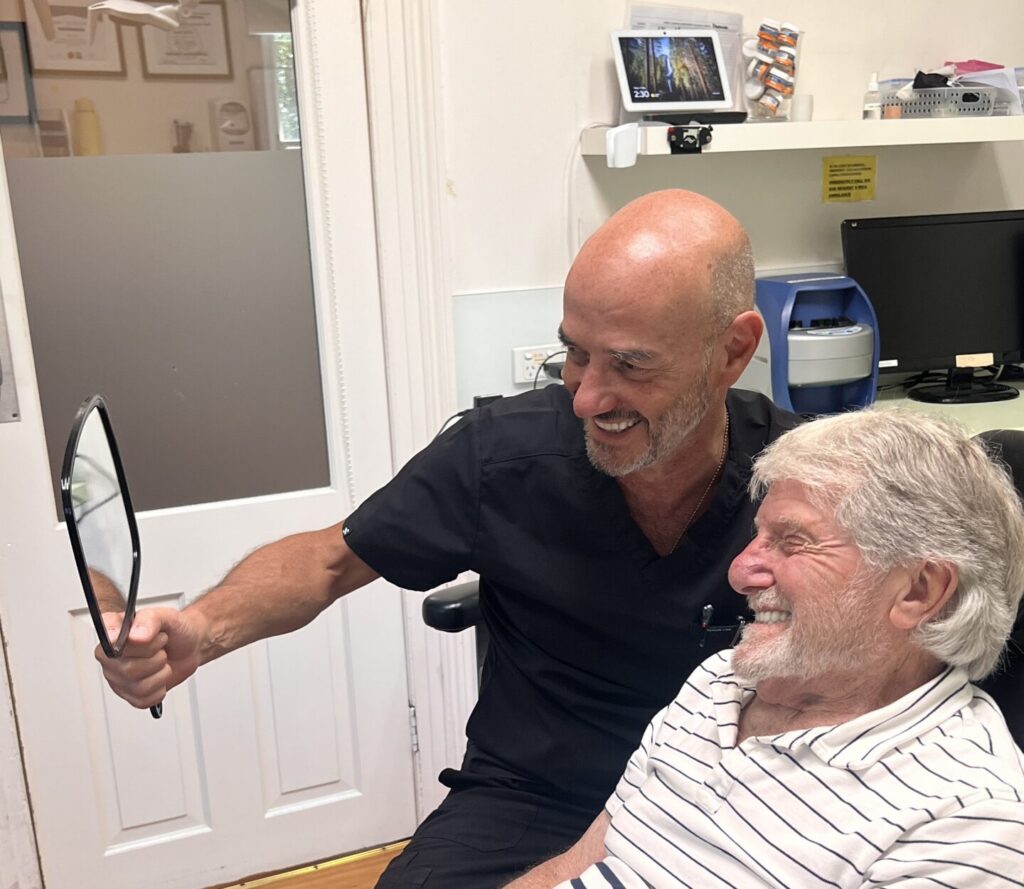 Dr Hillel New and a patient at a regular dental check-up.